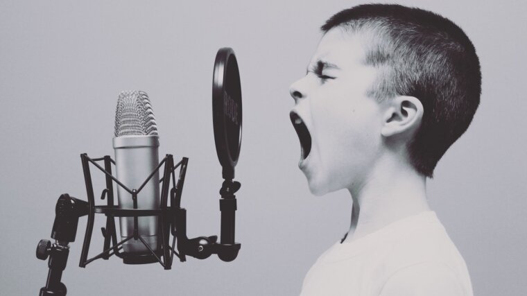 Boy Screaming into Microphone