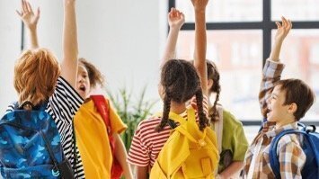Primary School Age Children high fiving